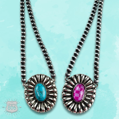 Western sunburst pendant on burnished silver bead necklace