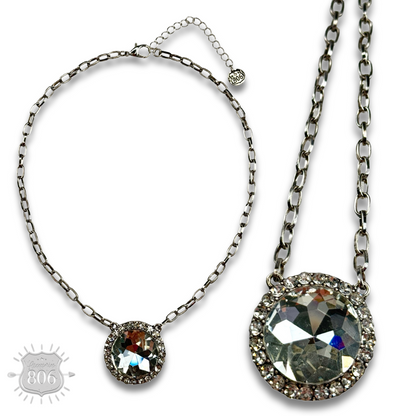 Large round pendant on silver link chain necklace