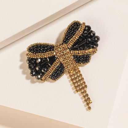 Myra Evening Grace Bow Brooch in Gilded Gold