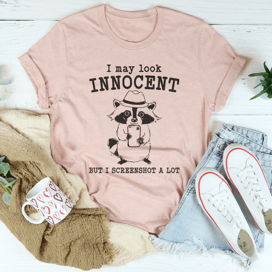 I May Look Innocent But I Screenshot A Lot Tee